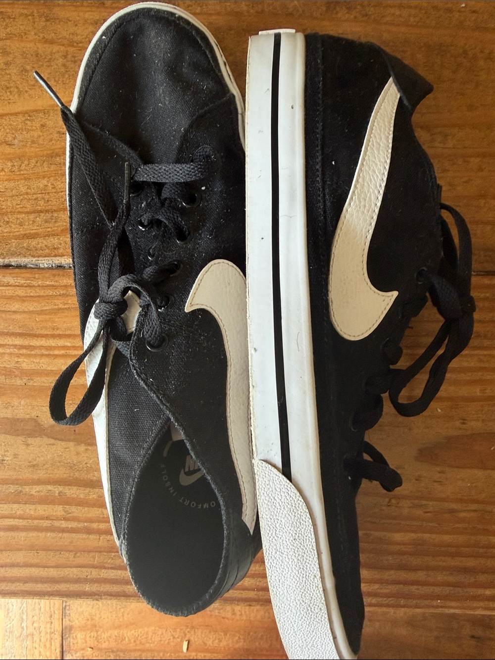 Nike women’s Black Sneakers with White Swoosh